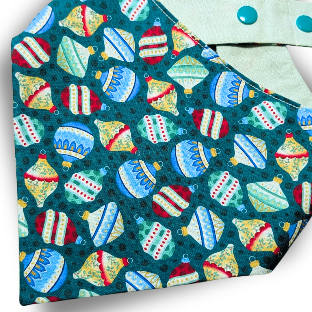 Close-up of colourful Christmas bauble design on handmade sustainable cotton dog bandana - The Jazzy Pooch