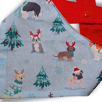 Close up picture fabric design for Christmas dog bandana featuring playful pups in winter scene - The Jazzy Pooch