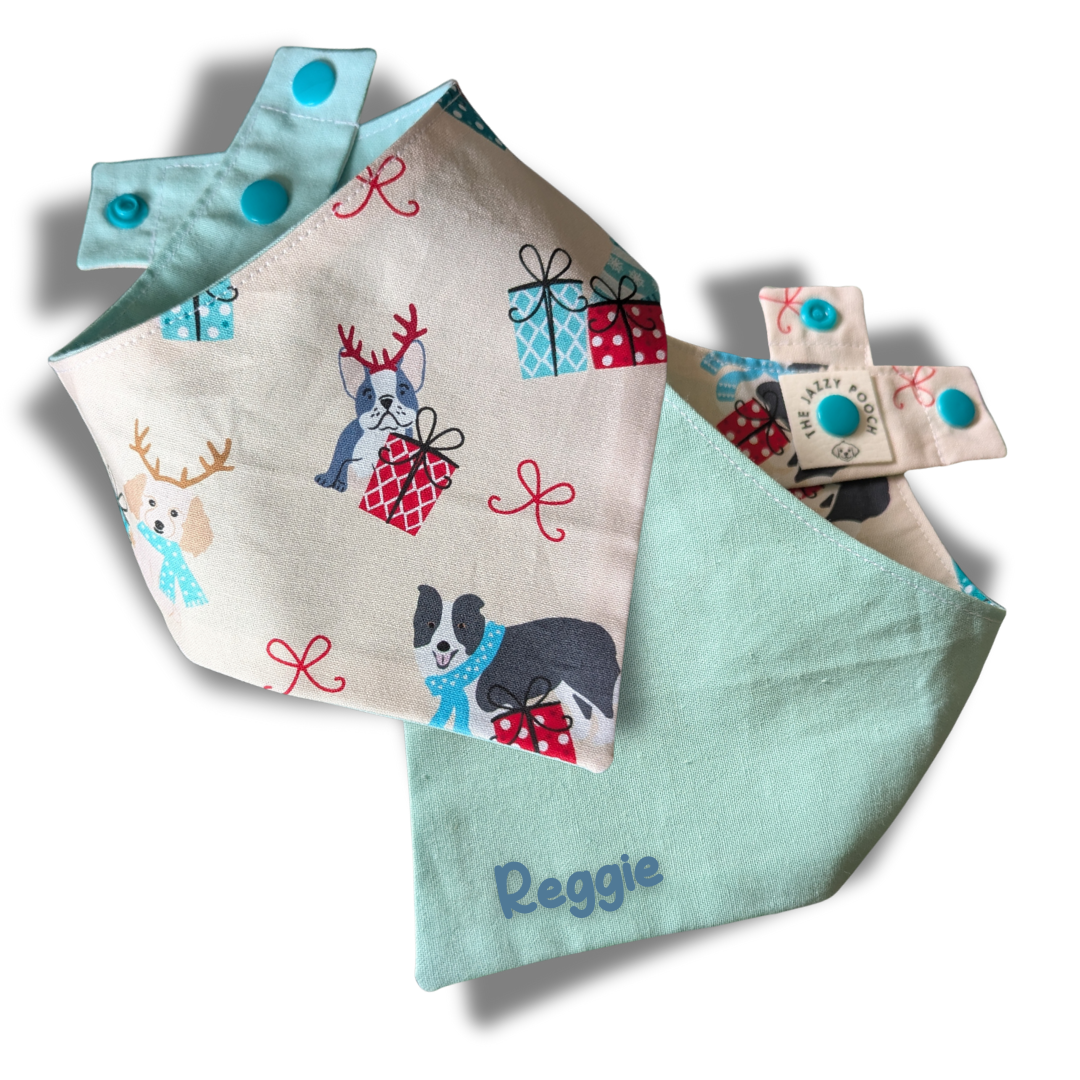 Sustainable reversible dog bandana. Side one has a Festive Christmas puppies pattern Side two is cool peppermint green with custom name. Adjustable popper closure - The Jazzy Pooch
