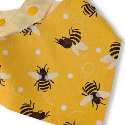 Detail of playful dancing bees fabric pattern on handcrafted sustainable cotton dog bandana - The Jazzy Pooch