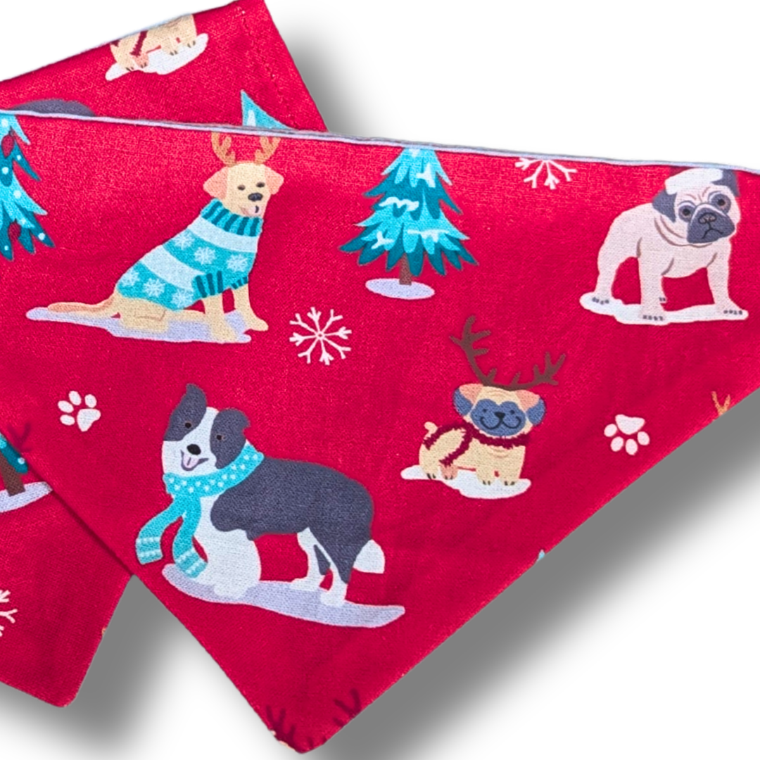 Eco-friendly slip-on dog bandana in classic red featuring adorable festive pups with Christmas antlers, planet-friendly over-the-collar style - The Jazzy Pooch