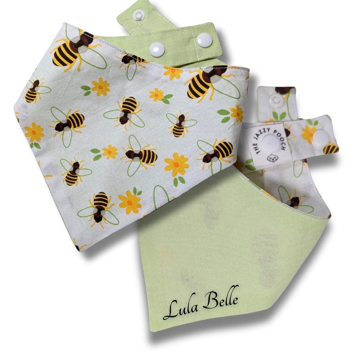 Reversible dog bandana displaying honeybees and flowers pattern with leafy green reverse and personalised pet name, handcrafted from sustainable reclaimed fabric - The Jazzy Pooch