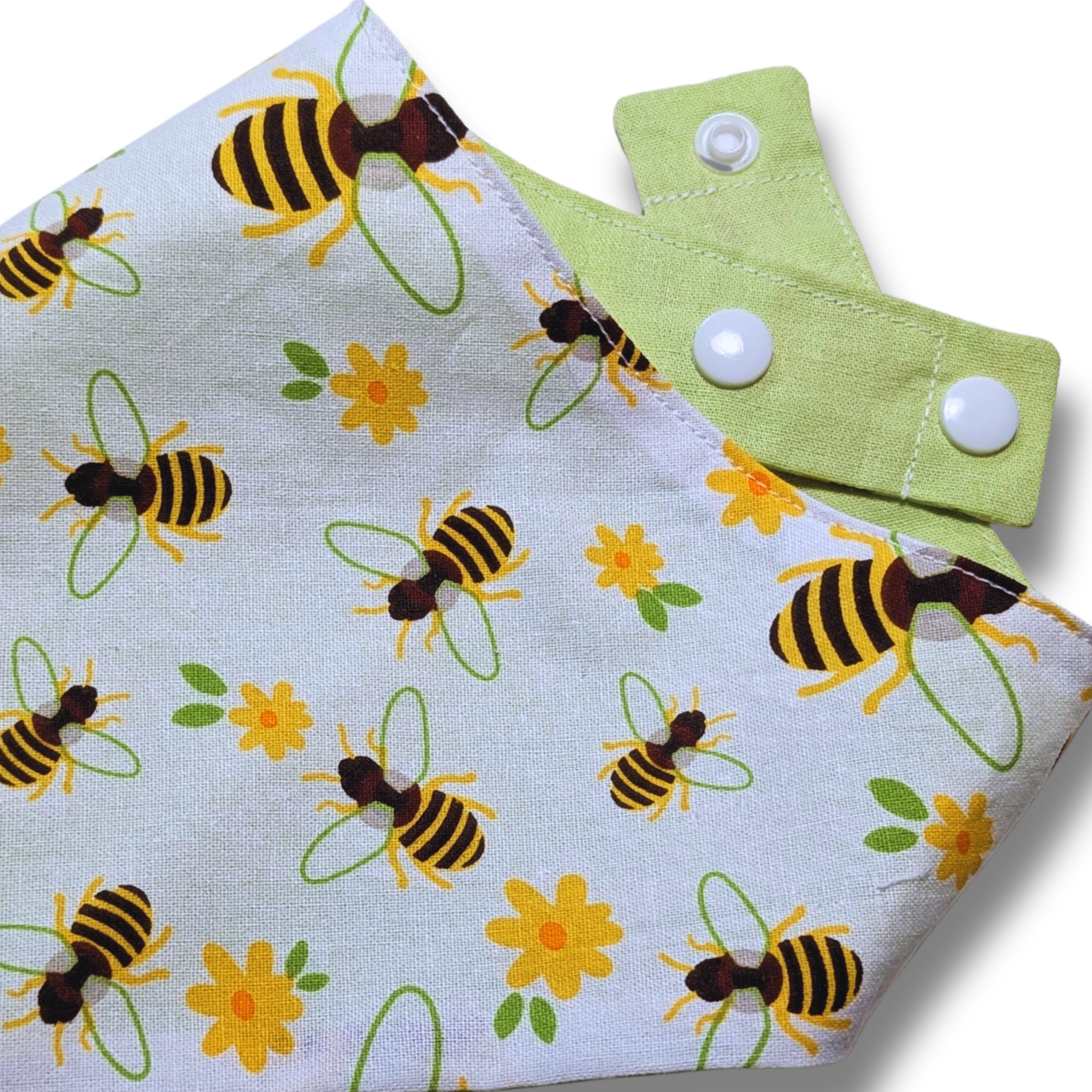 Close-up detail of charming honeybee and flower pattern on eco-friendly reclaimed cotton dog bandana - The Jazzy Pooch