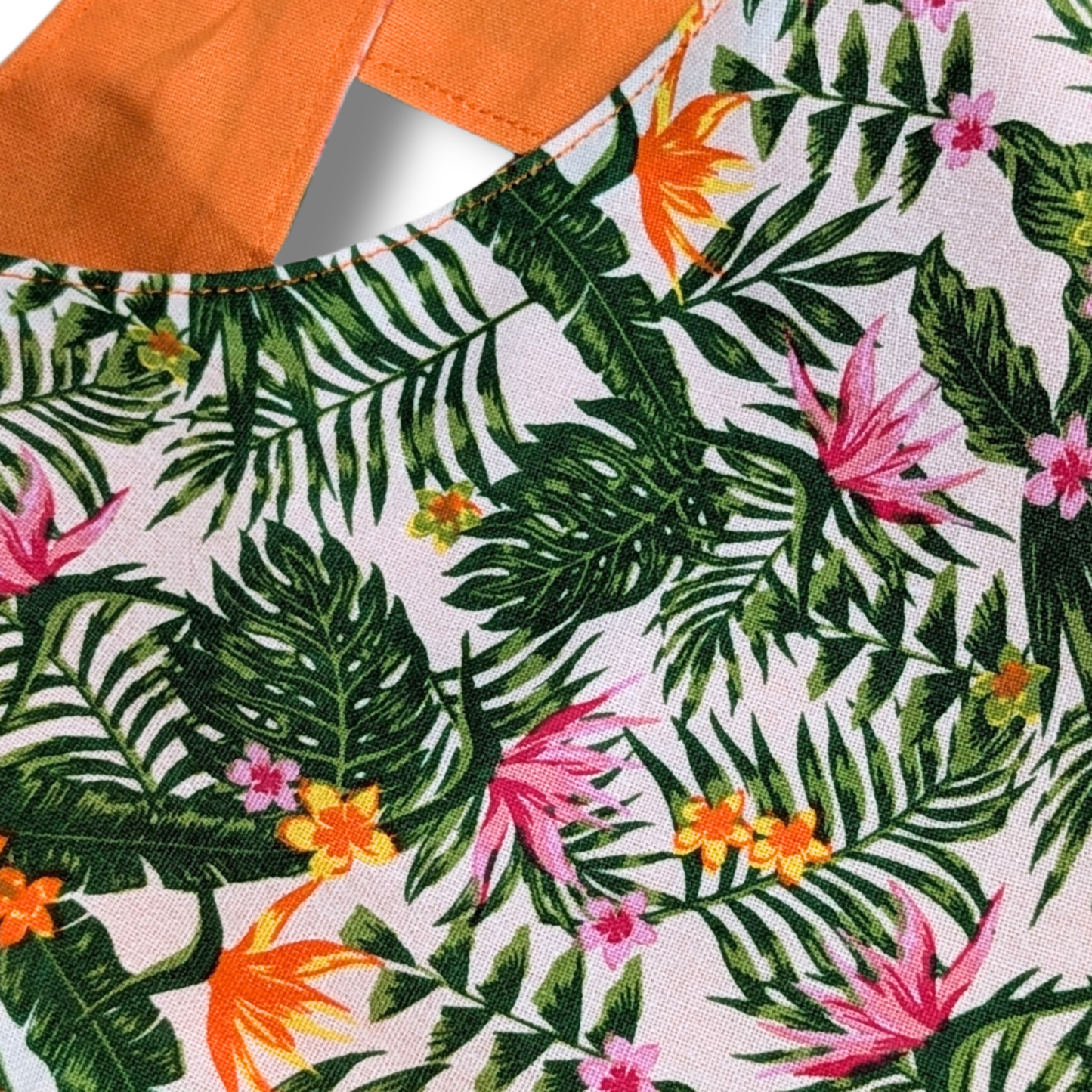 Close-up of bold tropical jungle flower and exotic foliage pattern on planet-friendly cotton dog bandana - The Jazzy Pooch