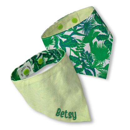 Reversible dog bandana showing tropical jungle leaves pattern and cool lime green reverse with personalised pet name - The Jazzy Pooch