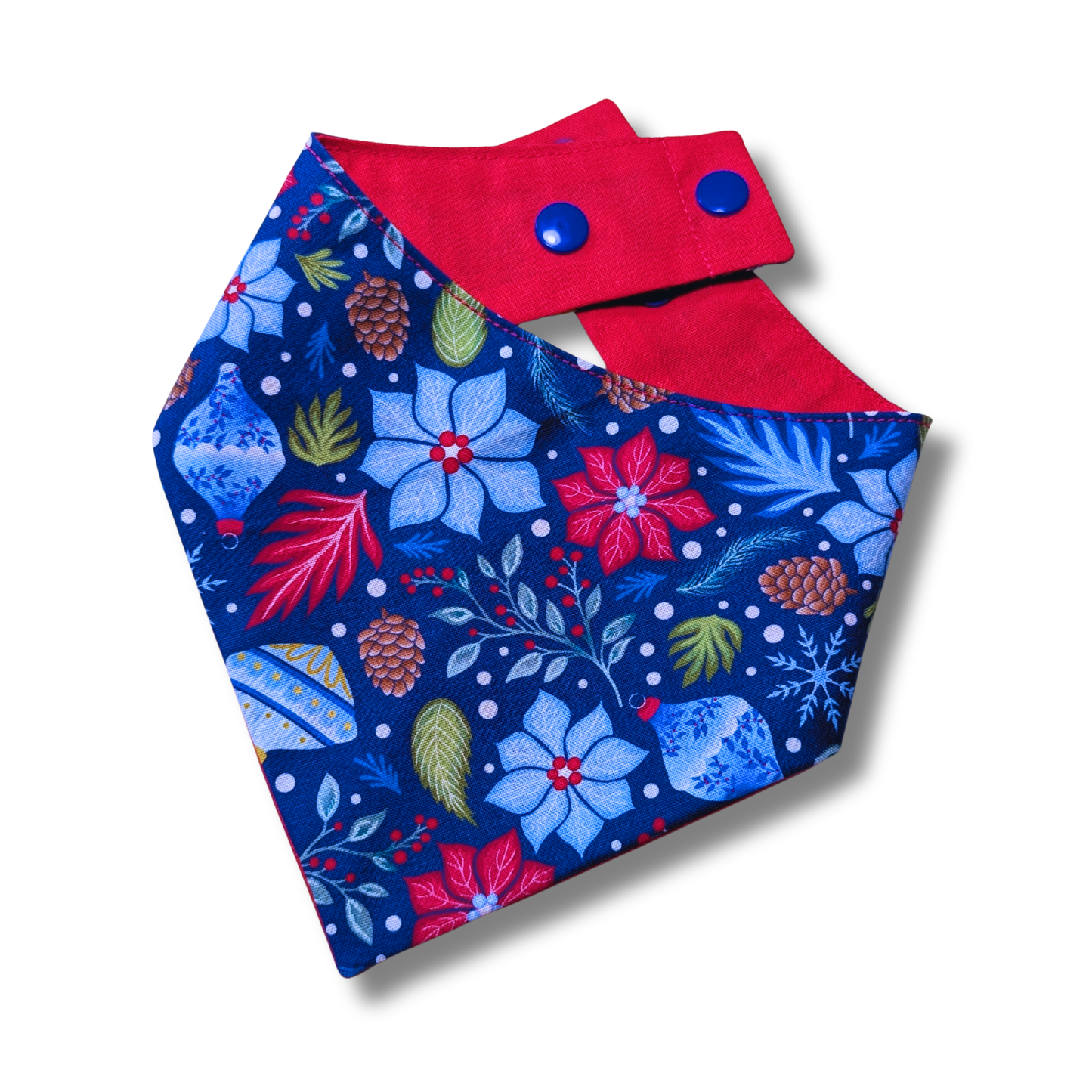 Reversible Christmas dog bandana displaying vibrant poinsettia flowers and festive baubles on blue background, handcrafted from reclaimed fabric - The Jazzy Pooch